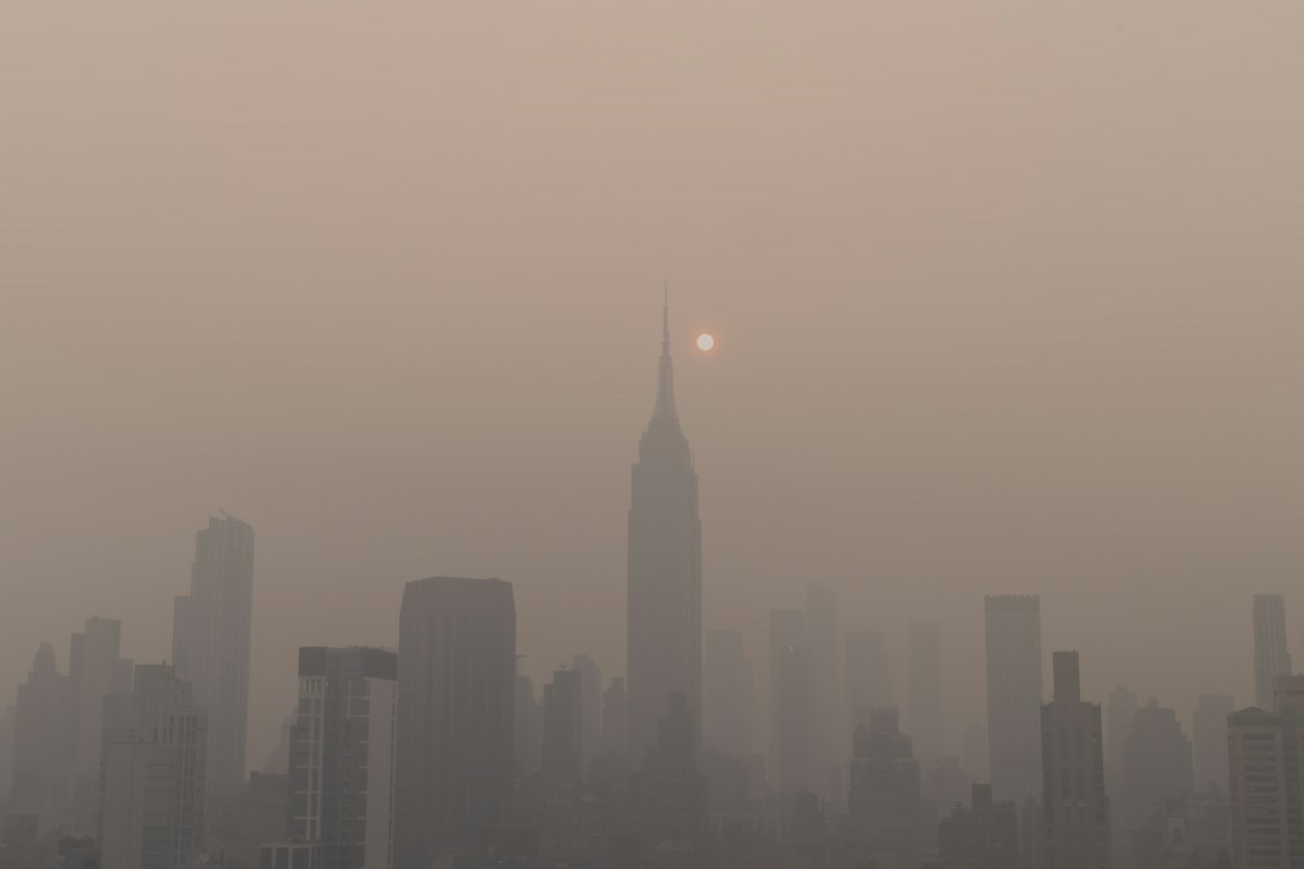 City skyline veiled in wildfire smoke and haze