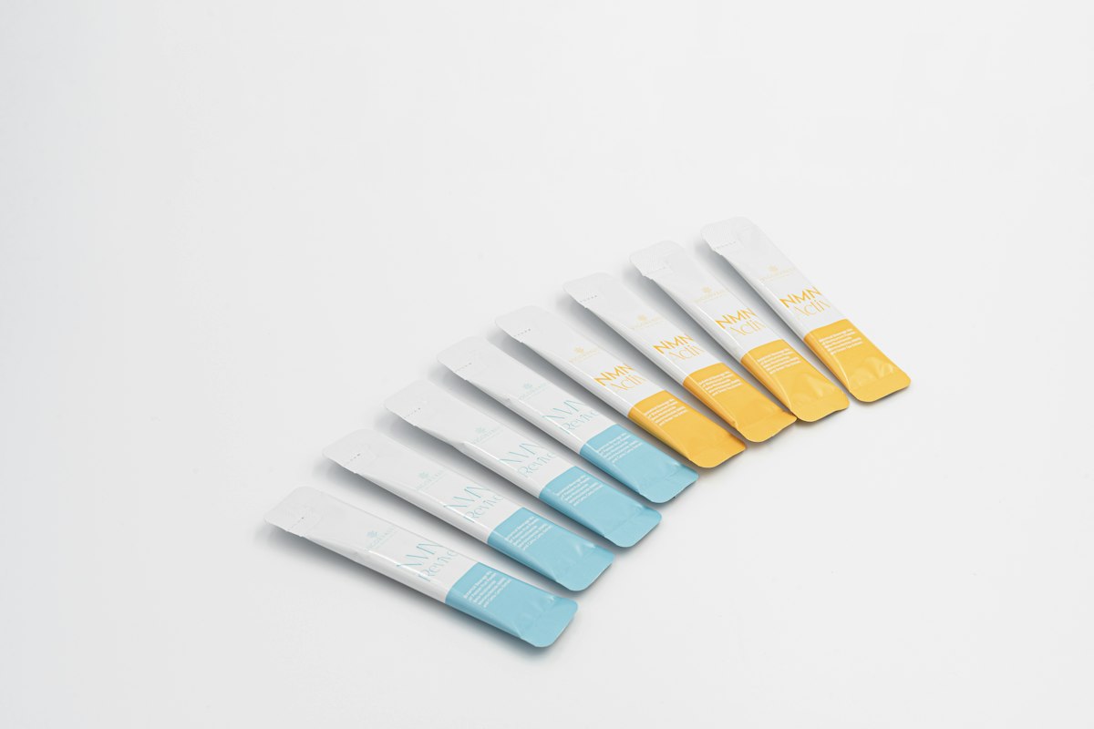 A row of toothbrushes sitting on top of a white table