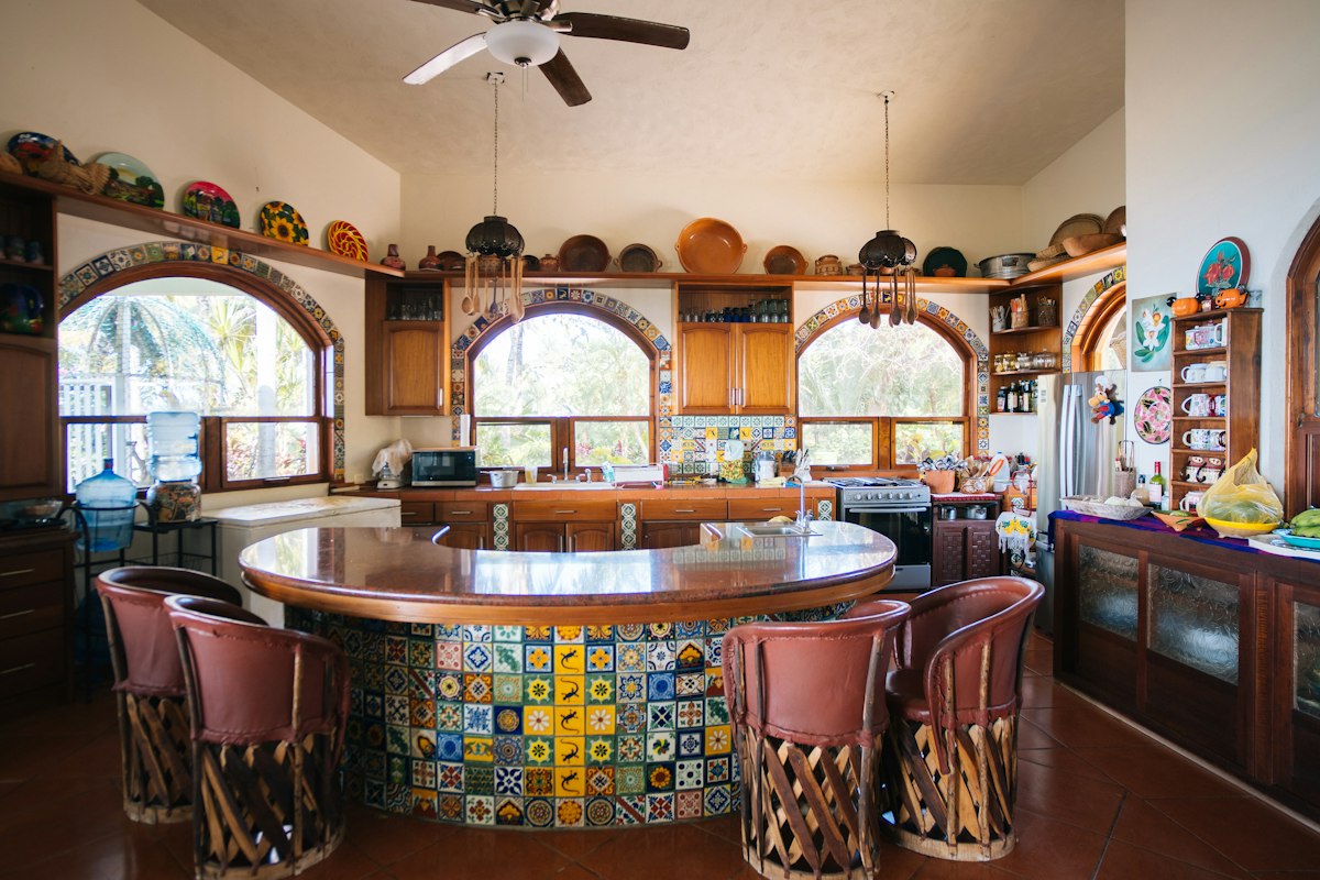 Spacious kitchen with large island and colorful tile details